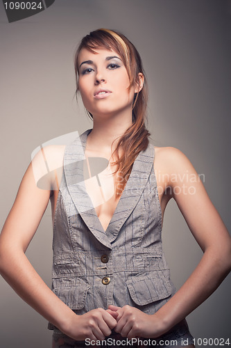 Image of attractive brunette girl in vest