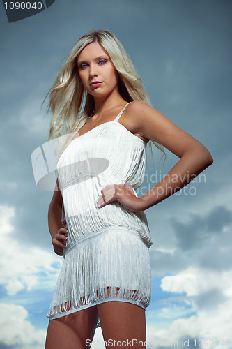 Image of attractive blond girl in white dress