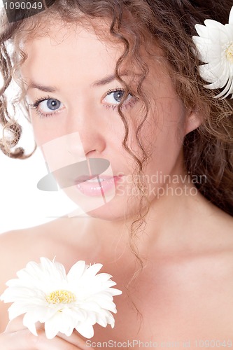 Image of young pretty woman with flower