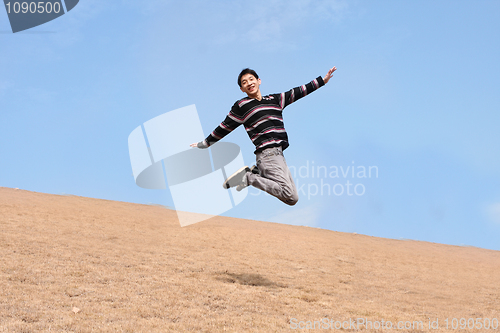 Image of Happy jumping man on winter day 