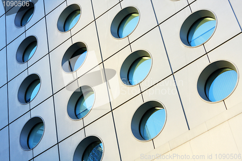 Image of Windows of modern building toned in blue color 