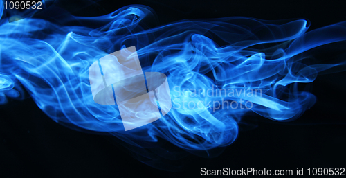 Image of Stream of a blue smoke on a black background 