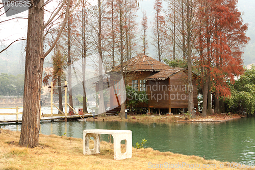 Image of white chiar and house on water front property 