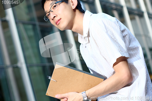 Image of young man studying at outdoor
