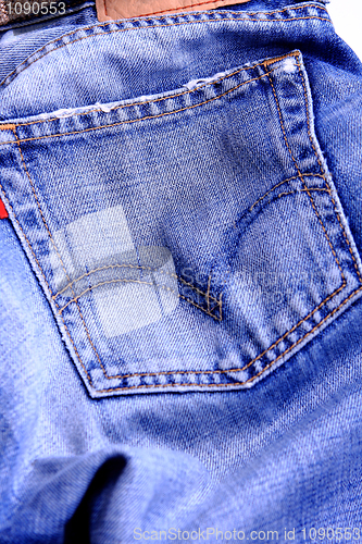 Image of Fragment of blue modern jeans with pocket, can be used as a back