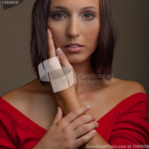 Image of attractive girl in red top