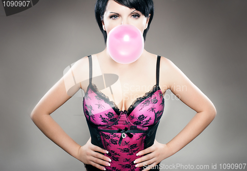 Image of sexy brunette with bubblegum