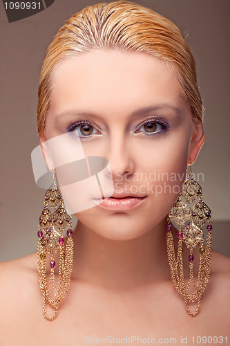 Image of attractive girl portrait wiht ethnic earring