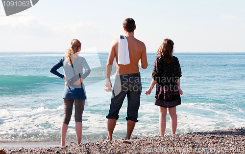 Image of man and two girls