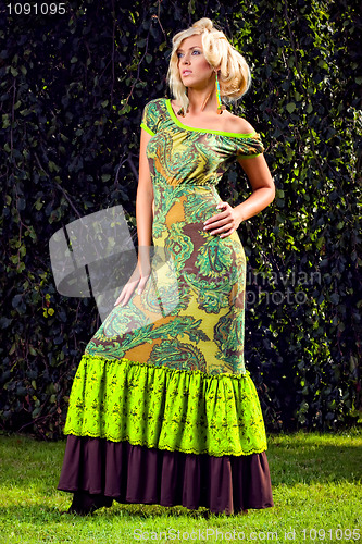 Image of attractive fashion blond girl in park