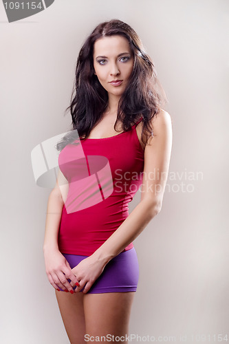 Image of attractive brunette girl in red shirt