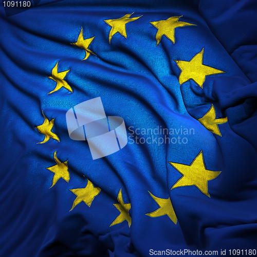 Image of The European Union flag, fluttering in the breeze, backlit risin