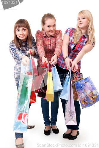 Image of Three girls with colorful shopping bags