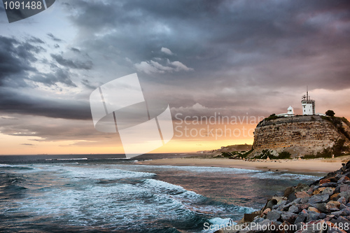 Image of lighthouse and ocean sunset