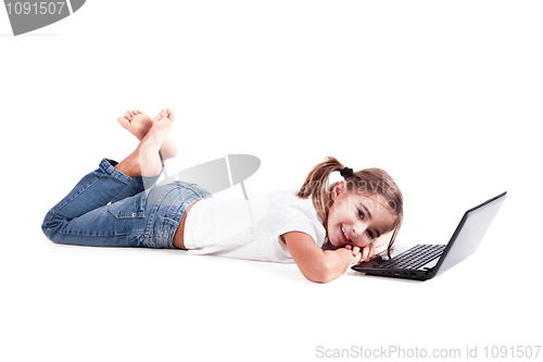 Image of Little student girl with a laptop