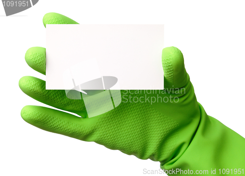Image of Hand in green glove showing business card