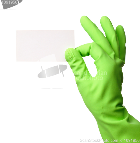 Image of Hand in green glove showing business card