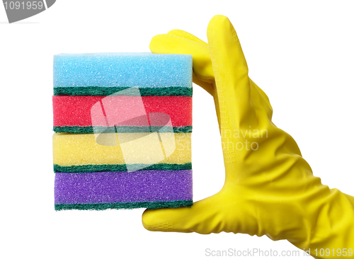 Image of Hand holding a pile of washing sponges