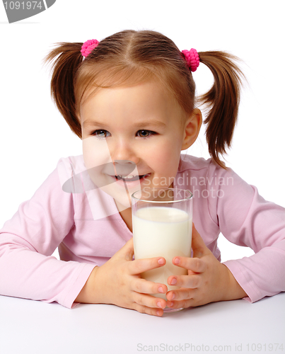 Image of Little girl with a glass of milk