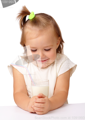 Image of Little girl with a glass of milk