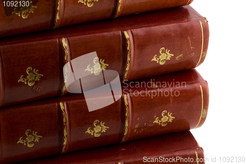 Image of stack of old books in red leather