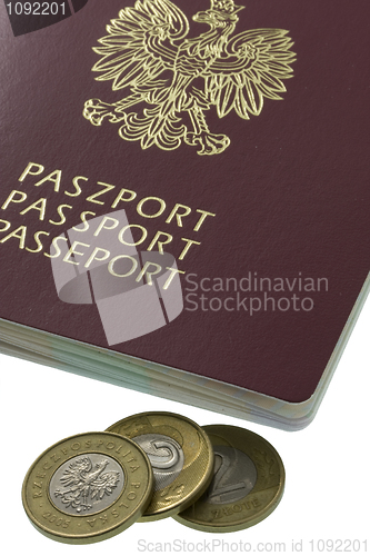 Image of Polish passport and three coins from Poland