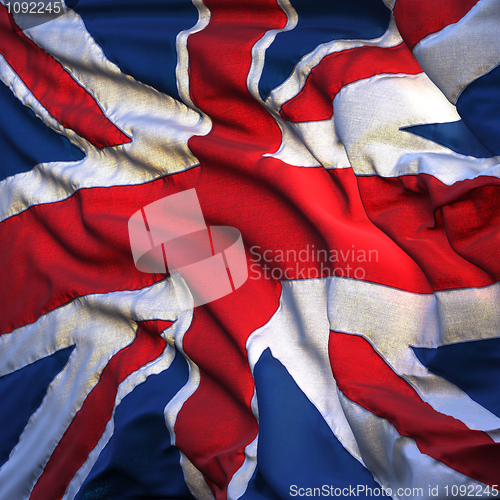 Image of Flag of the United Kingdom, fluttering in the breeze, backlit ri