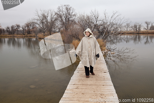 Image of senior woman enjoys a walki alone