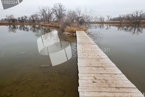 Image of boardwalk pathway over lake and swamp