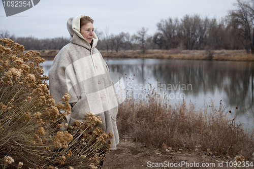 Image of senior woman enjoys a walk outdoors