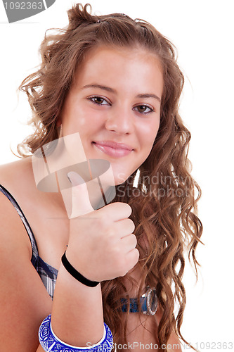 Image of pretty girl with thumb raised as a sign of success,