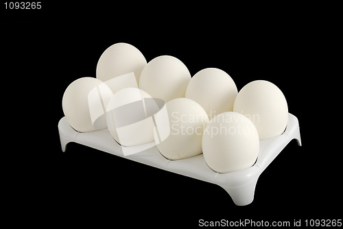 Image of Eight white eggs in carton