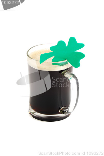 Image of Glass of dark beer decorated with 4-leaf clover