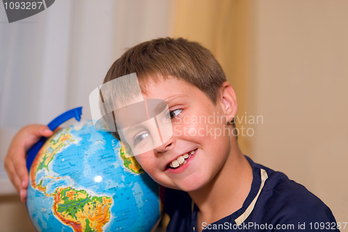 Image of boy with globe of world 