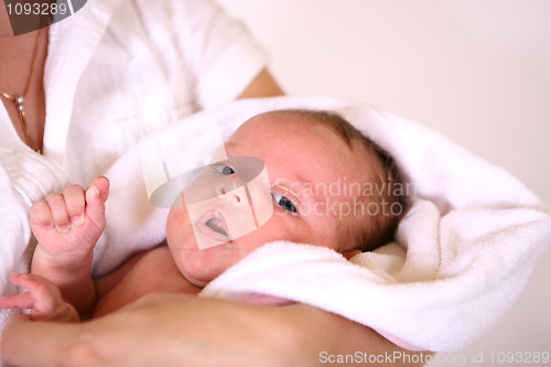 Image of baby after bath in towel. soft focus 