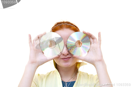 Image of redhead young woman holding a CD