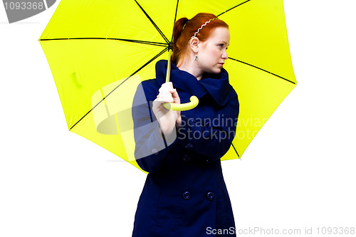 Image of redhead young woman holding an  umbrella