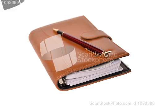 Image of Daily planner with pen isolated on white background 