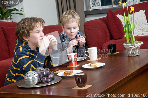 Image of Two brothers in a livingroom