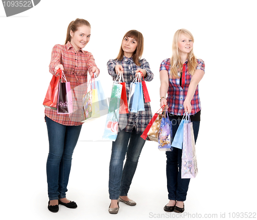 Image of Three girls with colorful shopping bags