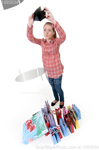 Image of girl looks into an empty wallet