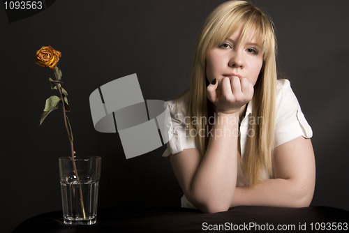 Image of young girl and rose