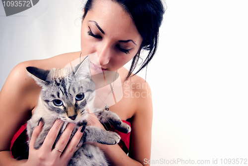 Image of pretty woman with cat    