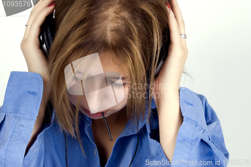 Image of Young girl in headphones   