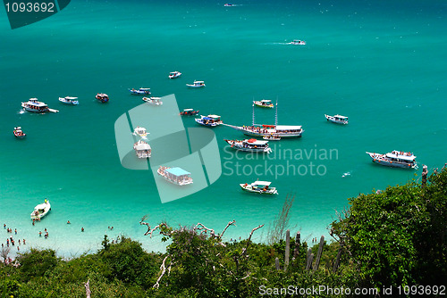 Image of Boats in a crystalline turquoise sea in Arraial do Cabo, Rio de janeiro, Brazil