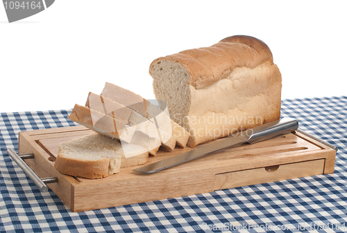 Image of Slices of bread on top of wooden board