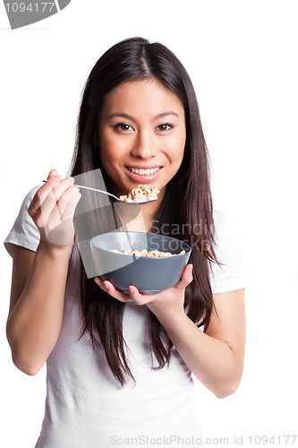 Image of Asian woman eating cereal