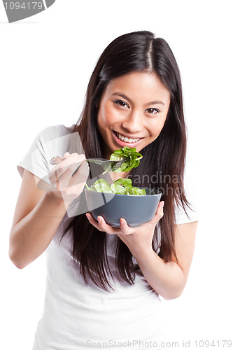 Image of Asian woman eating salad