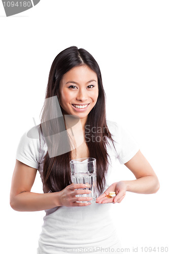 Image of Asian woman taking vitamins