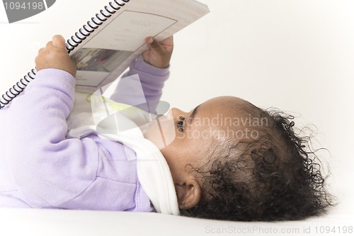 Image of Baby reading a book